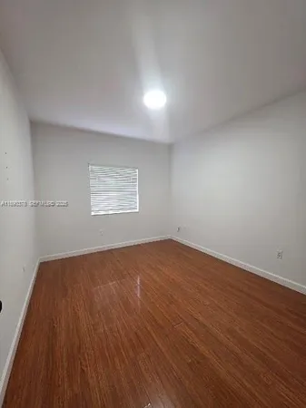 a room with a fireplace and cabinets
