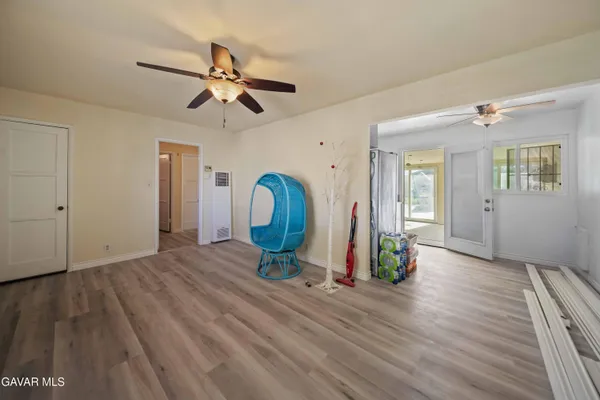 a view of a room with wooden floor