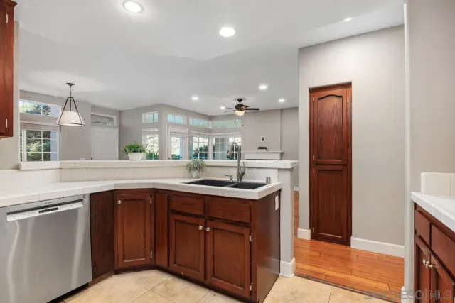 a kitchen with a sink and cabinets