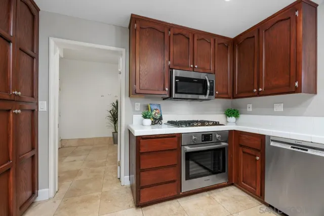 a kitchen with a stove and a microwave