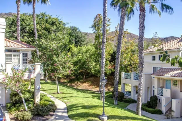 a view of a swimming pool and outdoor seating