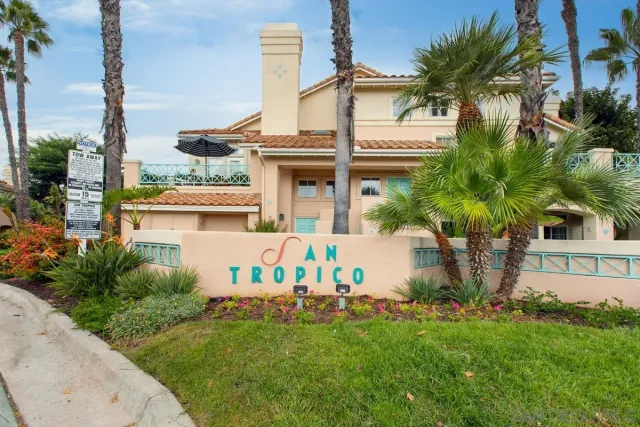 a view of a street with cars on road