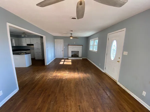 a view of a livingroom with wooden floor