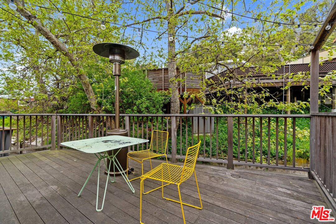 68 Paradise Cove Road Malibu, CA 90265 - Photo 11 of 28 a view of a chairs and table in the terrace