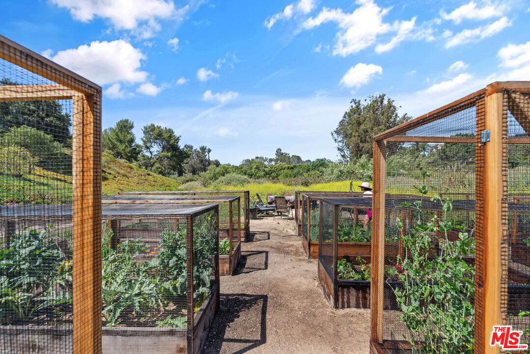 68 Paradise Cove Road Malibu, CA 90265 - Photo 27 of 28 a view of a balcony with chairs and a table