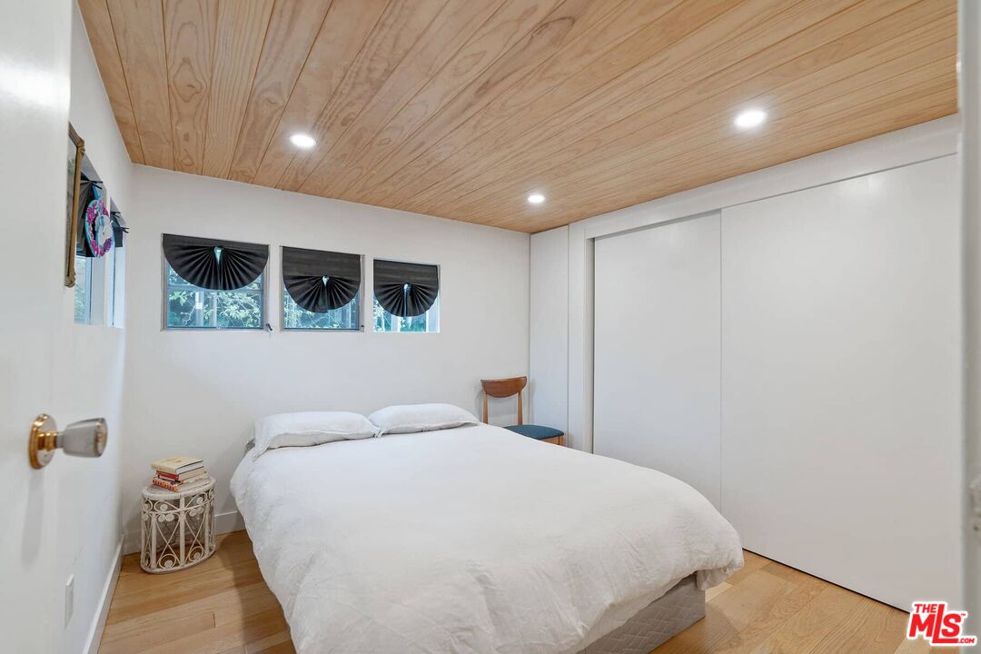 68 Paradise Cove Road Malibu, CA 90265 - Photo 7 of 28 a bedroom with a large bed and a large window