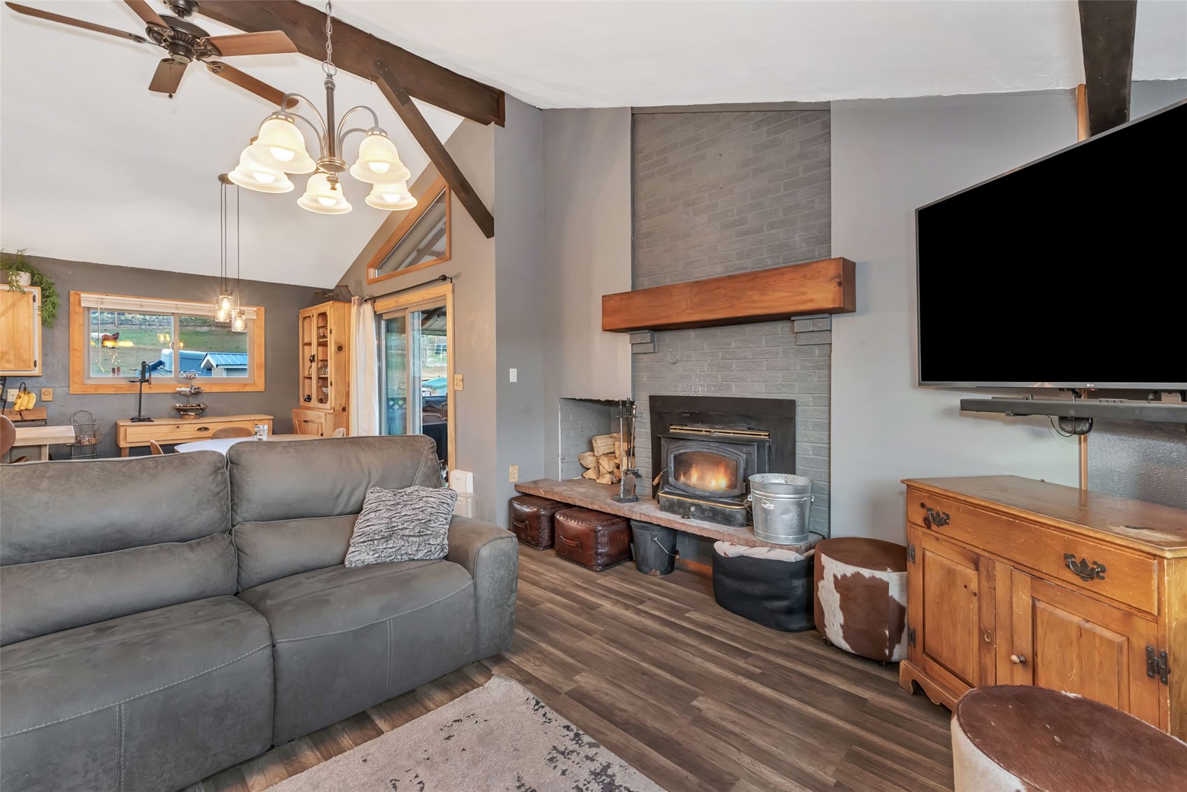 224 C R 206 Craig, CO 81625 - Photo 7 of 50 a living room with furniture a flat screen tv and a fireplace
