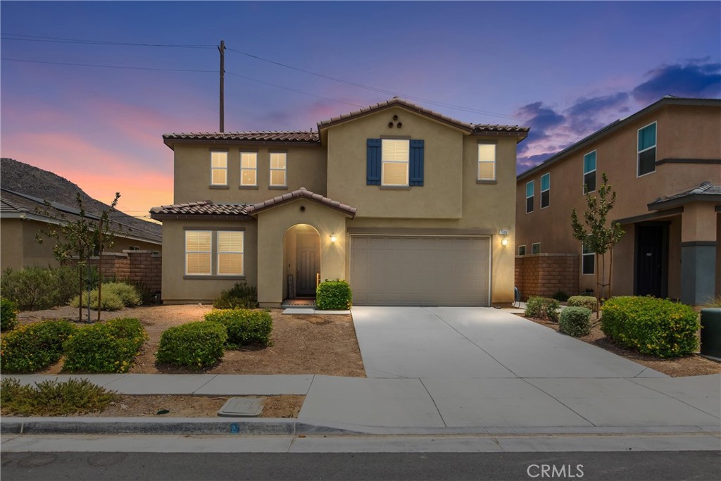 7596 Citrusmoon Court Riverside, CA 92507 - Photo 1 of 1 a front view of a house with a yard