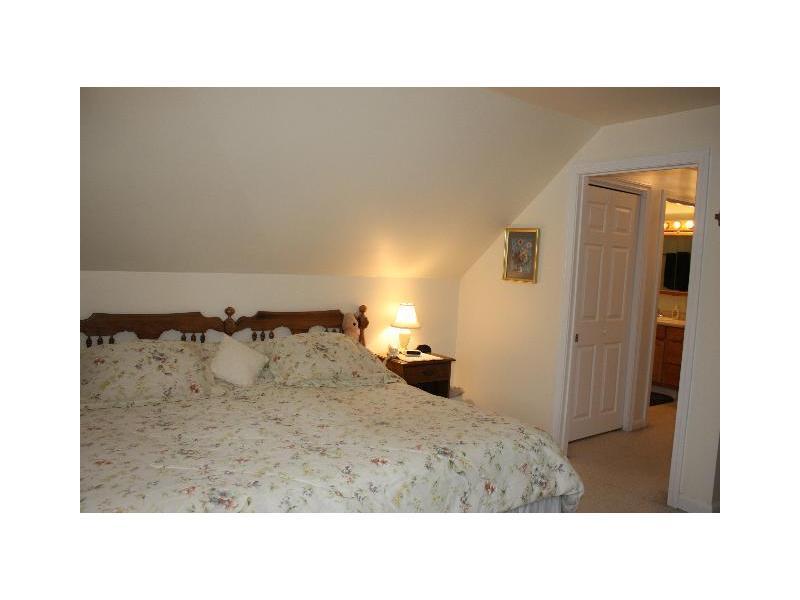 55 Willow Grove Road, Unit 55 Brunswick, ME 04011 - Photo 21 of 28 Bedroom. Bedroom with bath on 2nd floor.
