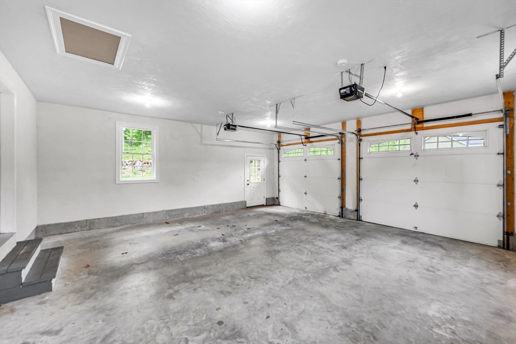 1310 North Brookfield Road Oakham, MA 01068 - Photo 30 of 30 an empty room with windows and ceiling fan