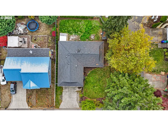 an aerial view of a house with a garden