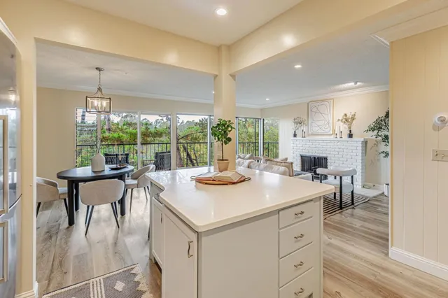 a kitchen with a table chairs and a counter top space