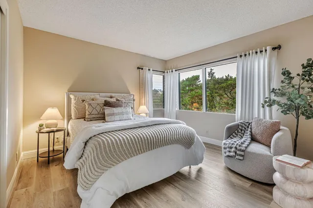 a bedroom with a bed and a couch