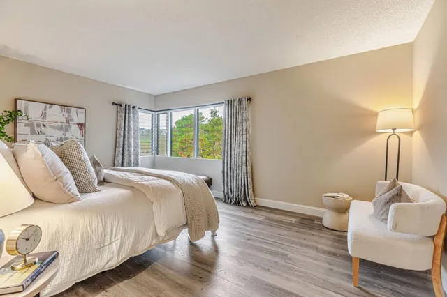 a bedroom with a bed and a couch