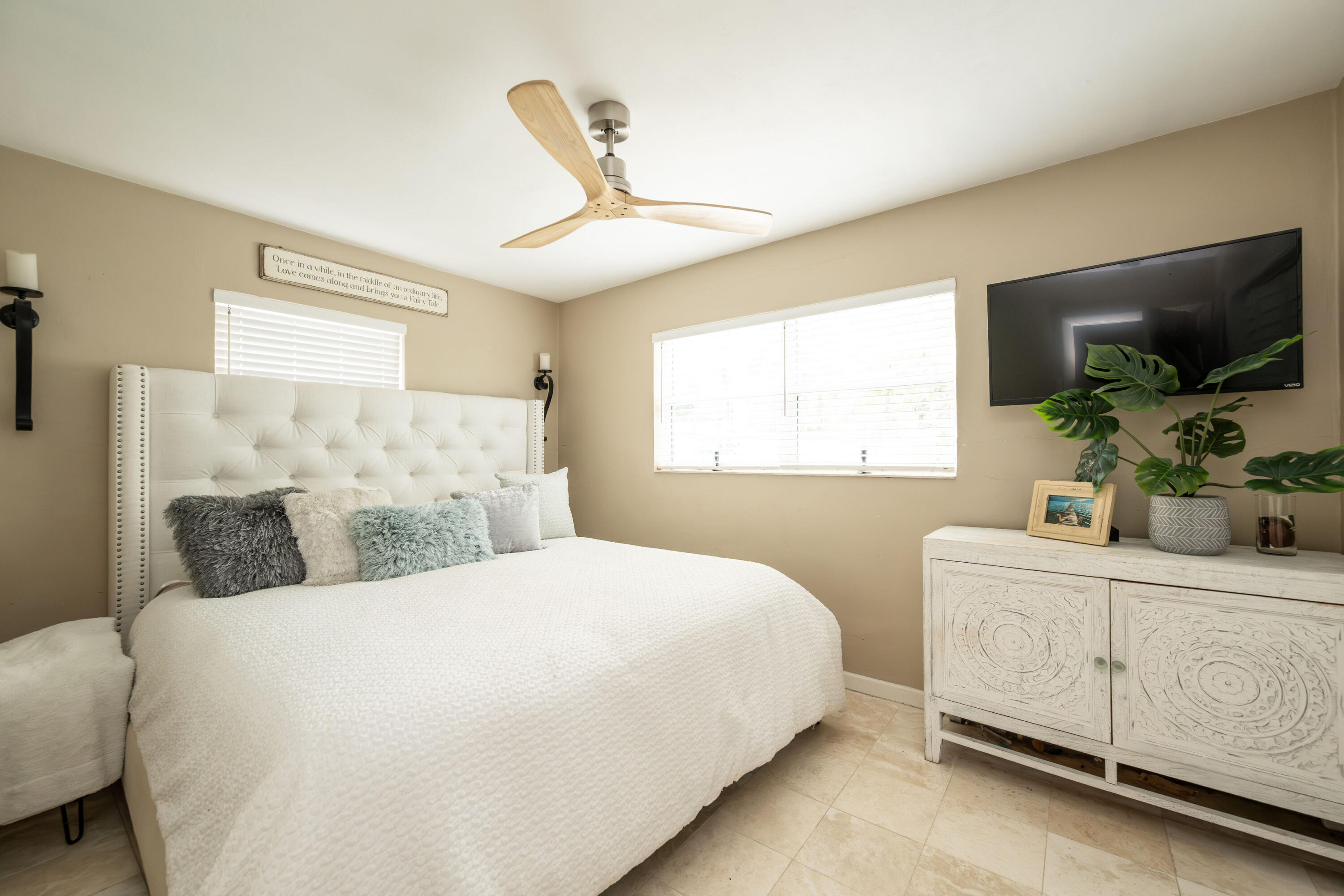 1523 Seminary Street Key West, FL 33040 - Photo 13 of 38 a bedroom with a large bed and a flat tv screen on dresser