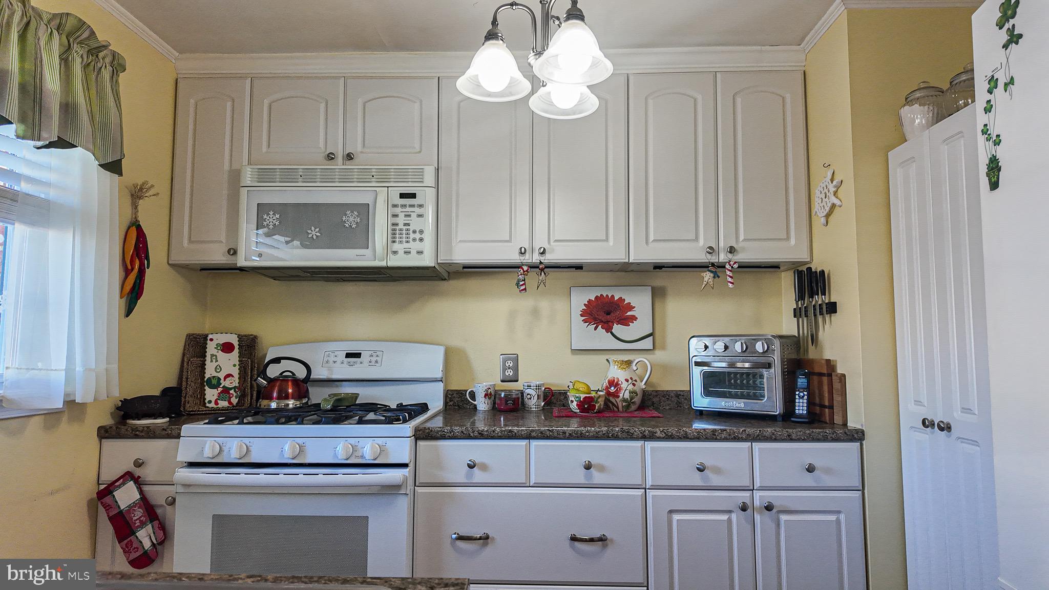 10964 Kipling Lane Philadelphia, PA 19154 - Photo 11 of 31 a kitchen with stainless steel appliances granite countertop a stove and cabinets