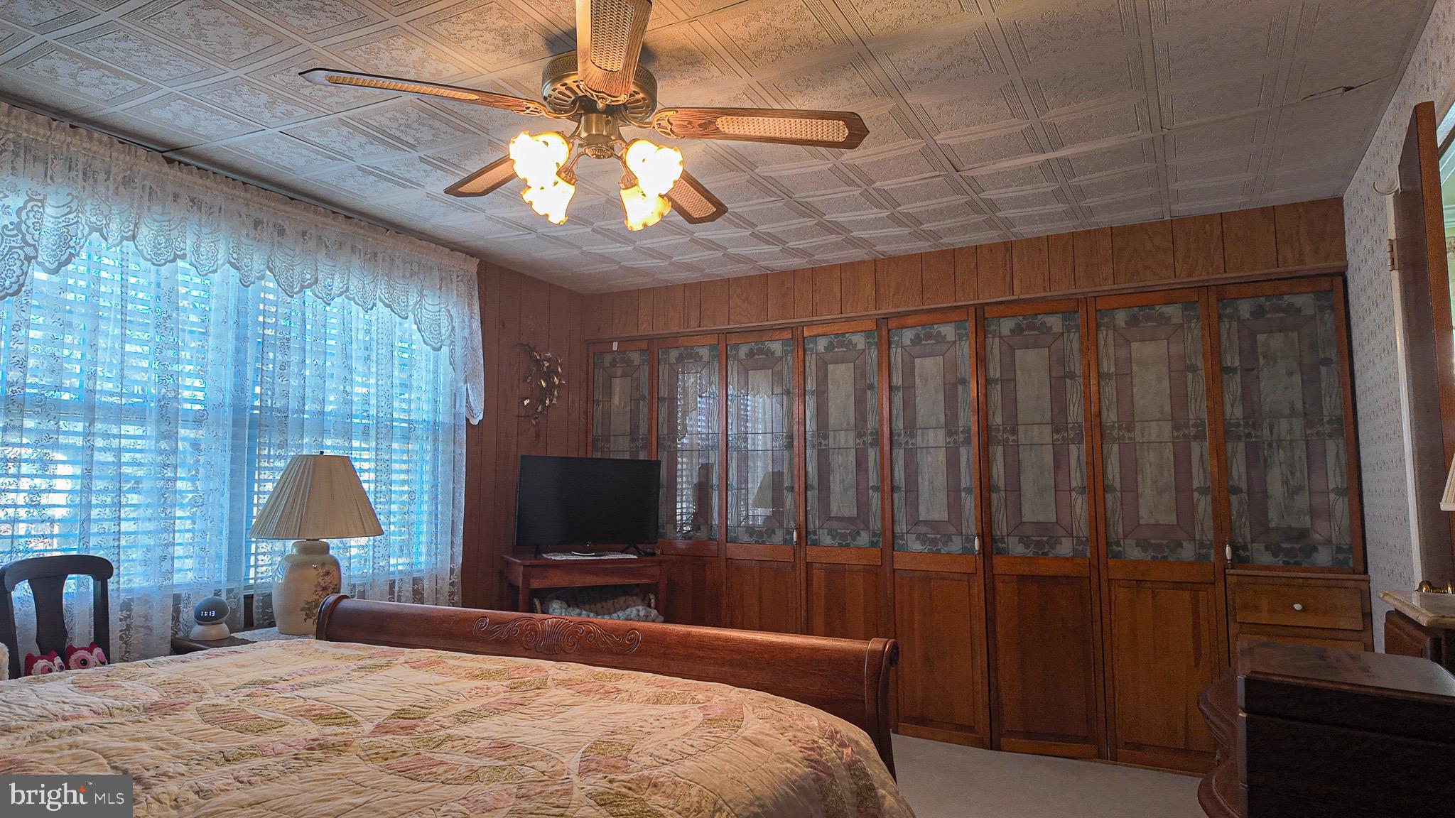10964 Kipling Lane Philadelphia, PA 19154 - Photo 15 of 31 a bedroom with a bed and a flat screen tv