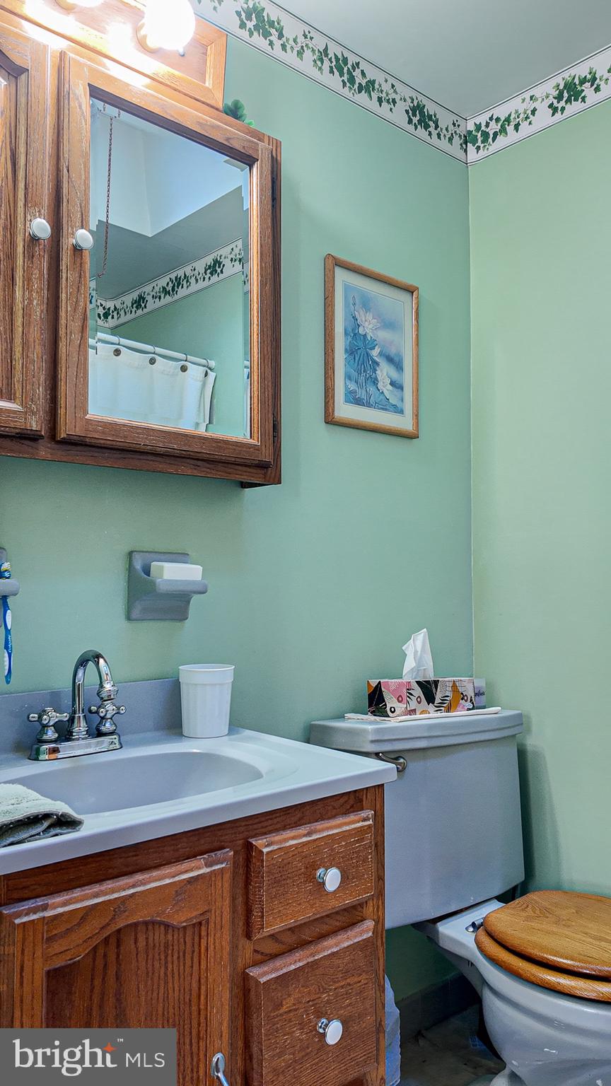 10964 Kipling Lane Philadelphia, PA 19154 - Photo 19 of 31 a bathroom with a granite countertop sink mirror vanity and toilet