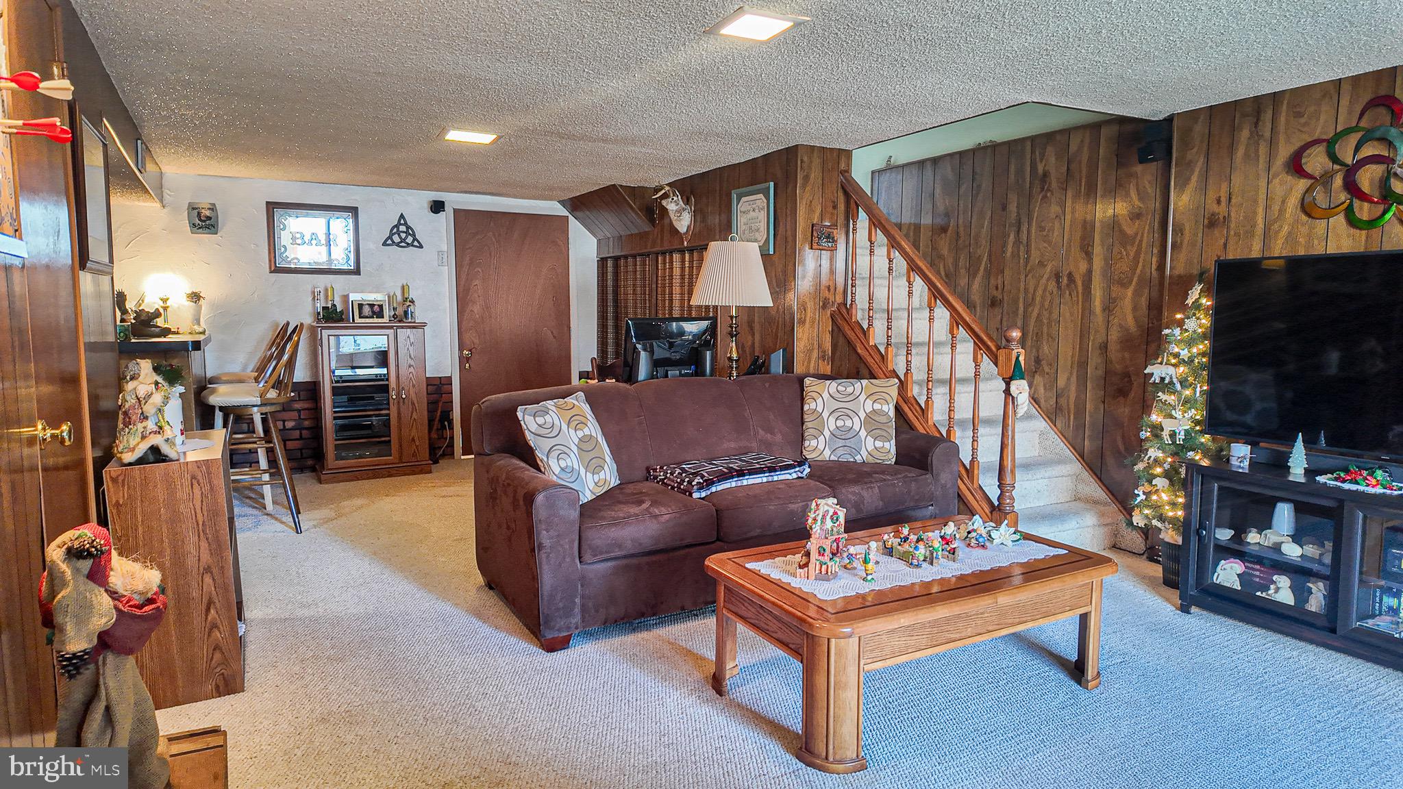 10964 Kipling Lane Philadelphia, PA 19154 - Photo 22 of 31 a living room with furniture and a flat screen tv