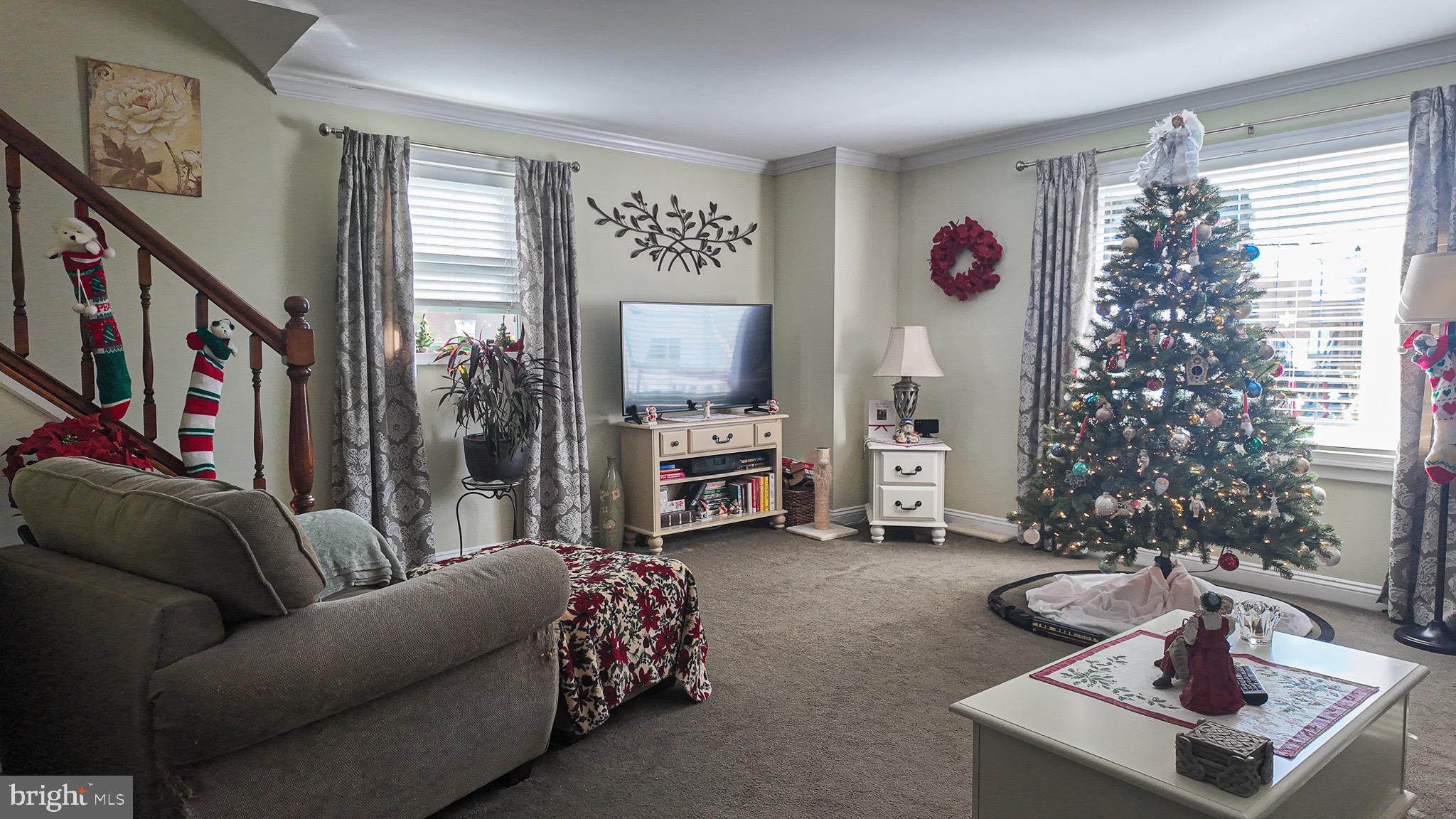 10964 Kipling Lane Philadelphia, PA 19154 - Photo 3 of 31 a living room with furniture a flat screen tv and a large window