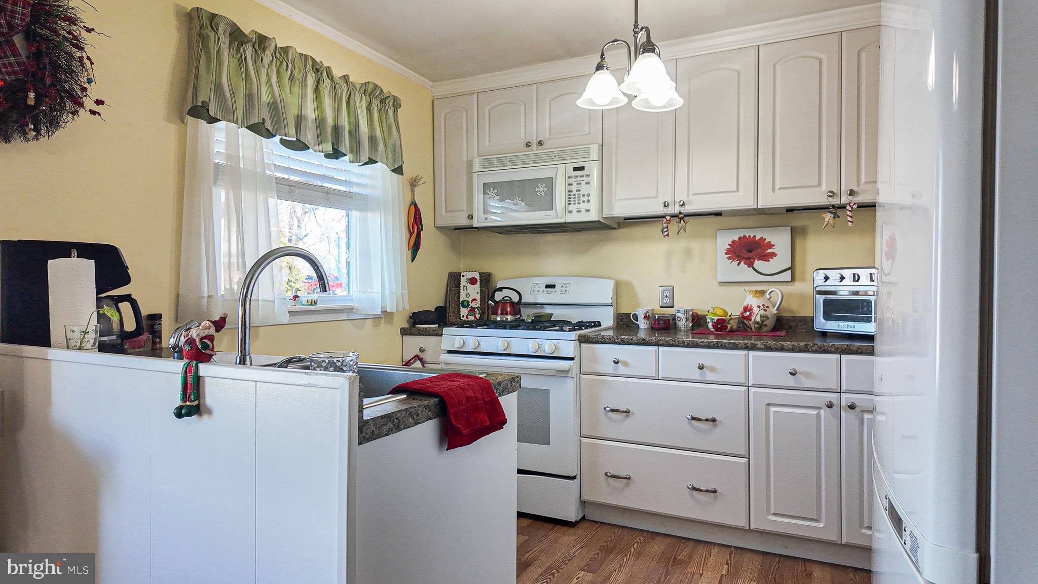 10964 Kipling Lane Philadelphia, PA 19154 - Photo 10 of 31 a kitchen with white cabinets and sink