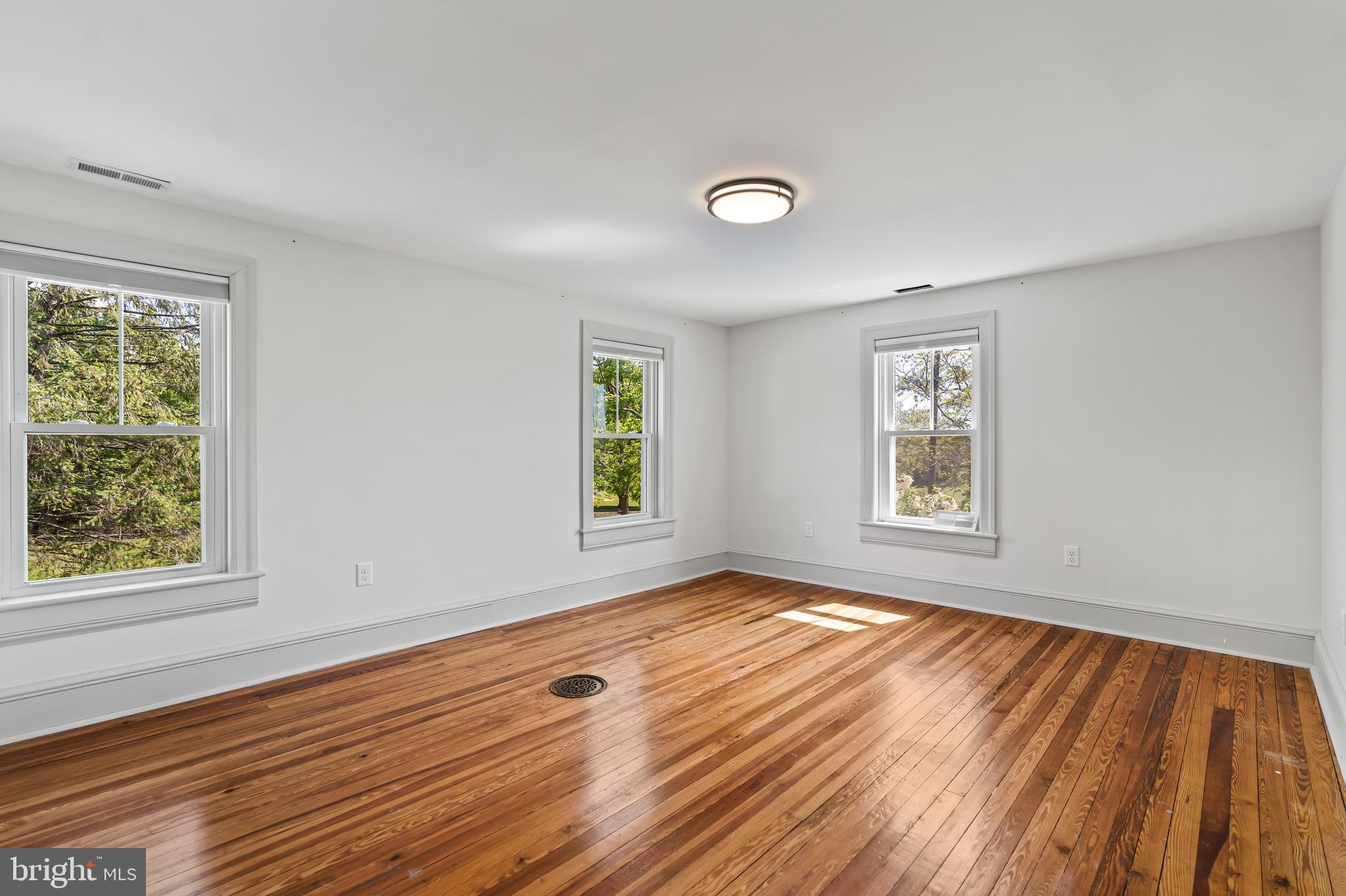 14005 Dry Run Road Clear Spring, MD 21722 - Photo 38 of 44 a view of an empty room with wooden floor and a window
