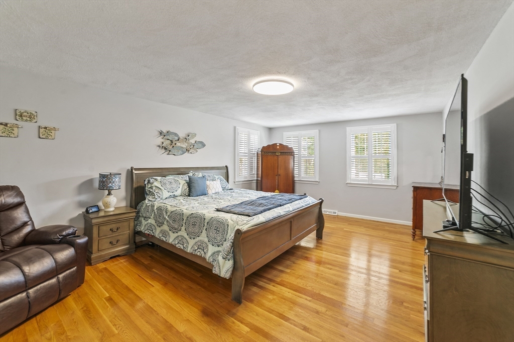 1904 Washington Street Canton, MA 02021 - Photo 20 of 39 a bedroom with a bed and a flat screen television