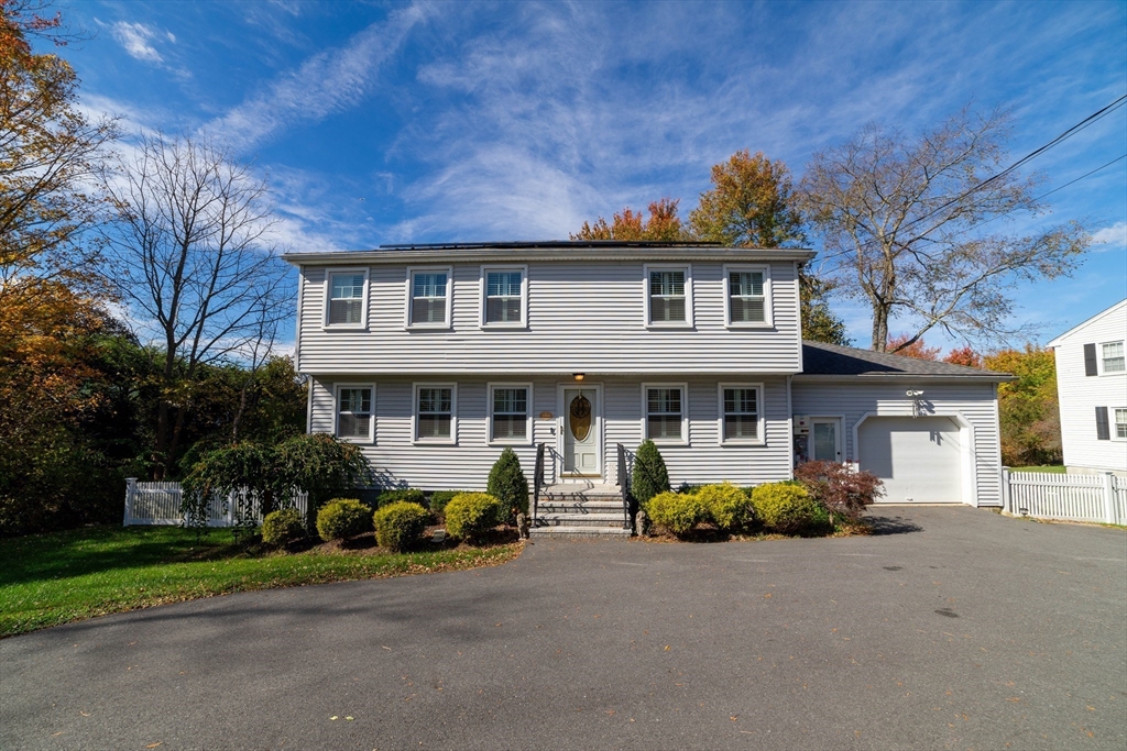 1904 Washington Street Canton, MA 02021 - Photo 2 of 39 a front view of a house with garden