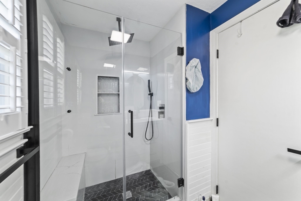 1904 Washington Street Canton, MA 02021 - Photo 22 of 39 a bathroom with a shower vanity and a sink