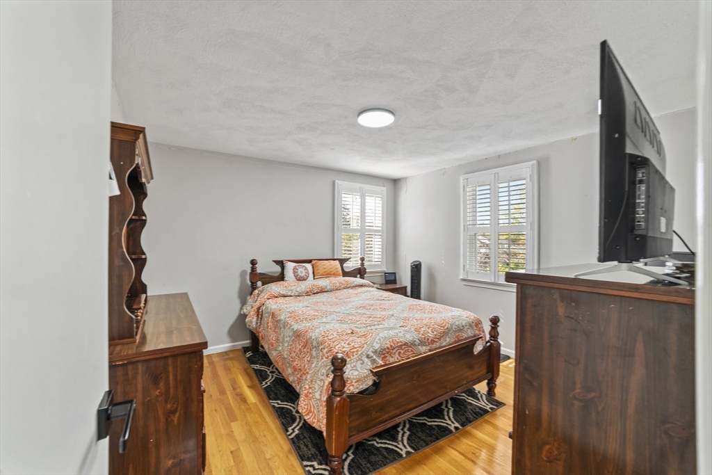 1904 Washington Street Canton, MA 02021 - Photo 23 of 39 a bedroom with a bed and window