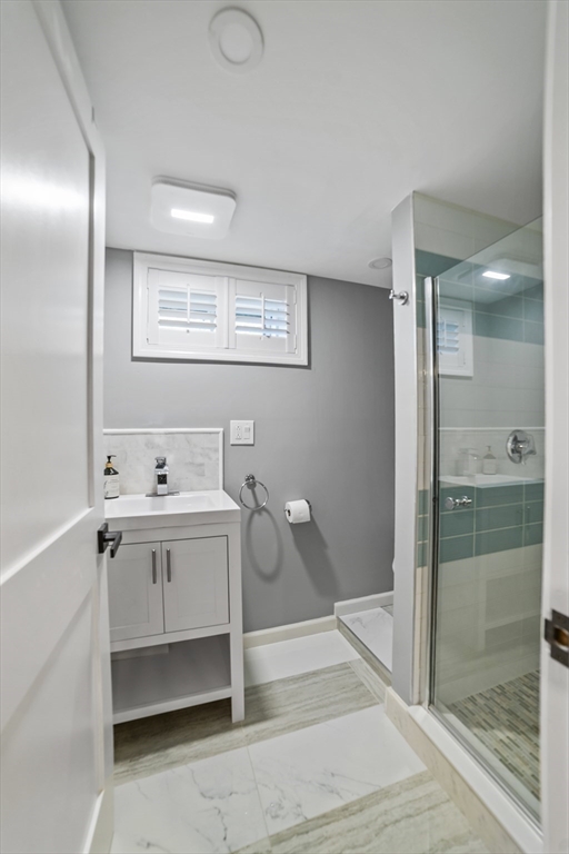1904 Washington Street Canton, MA 02021 - Photo 34 of 39 a bathroom with a sink a toilet and shower