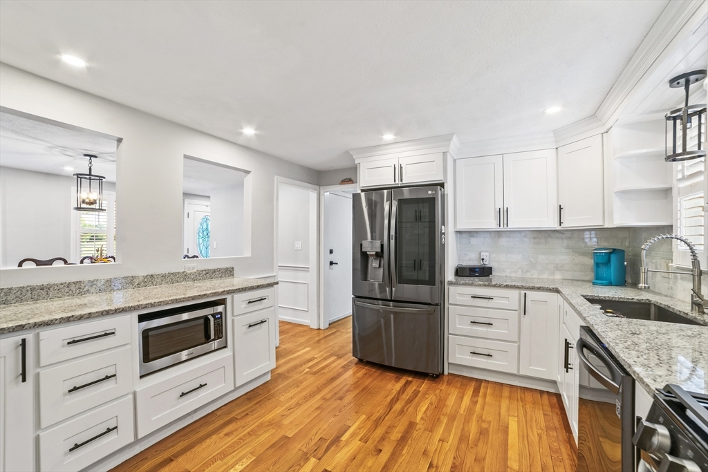 1904 Washington Street Canton, MA 02021 - Photo 5 of 39 a kitchen with granite countertop a refrigerator stove and sink