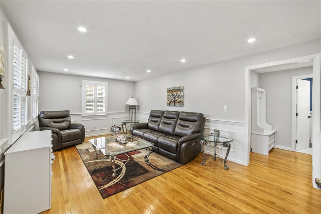 1904 Washington Street Canton, MA 02021 - Photo 10 of 39 a living room with furniture and a wooden floor
