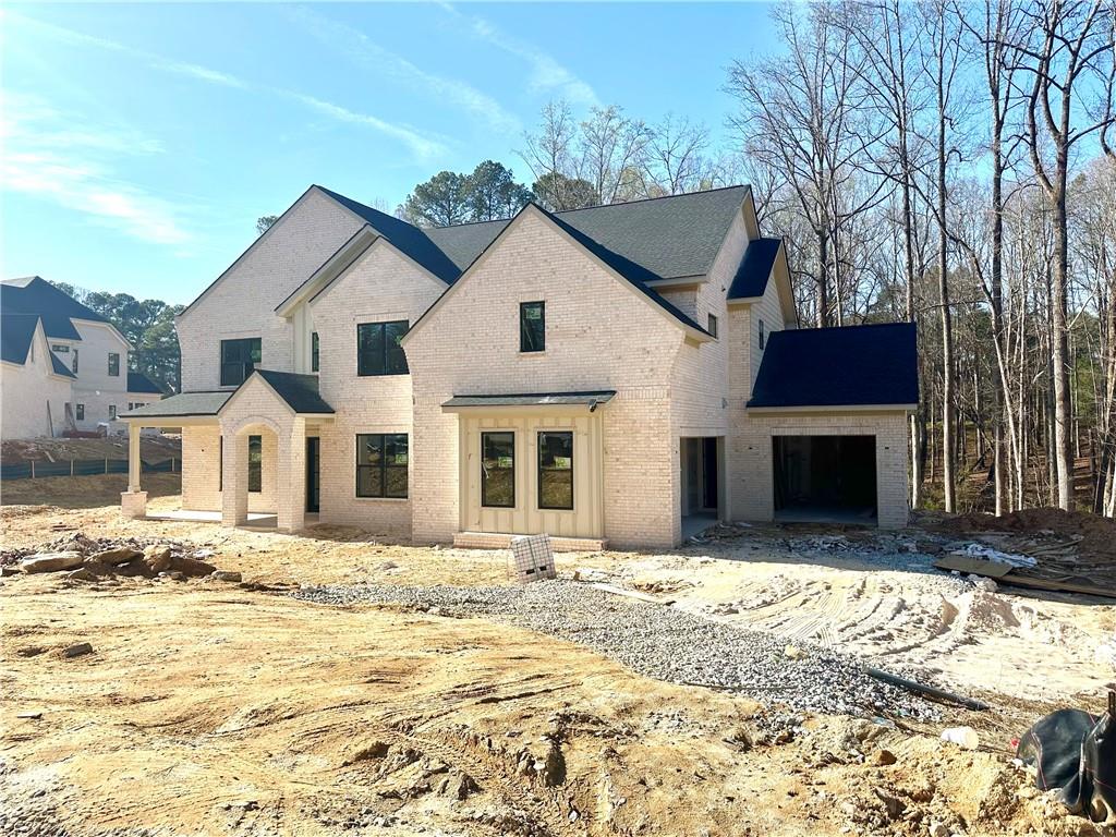 1560 Ewing Chapel Road Dacula, GA 30019 - Photo 1 of 15 a front view of a house with a yard