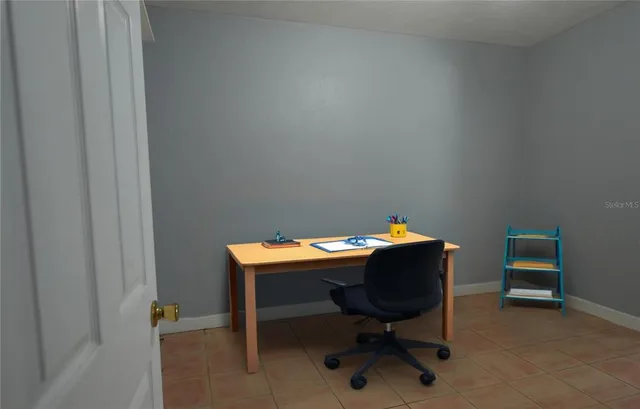 a view of a workspace with furniture