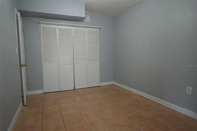 an empty room with a bench