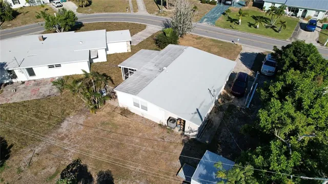 an aerial view of a house with a lake view