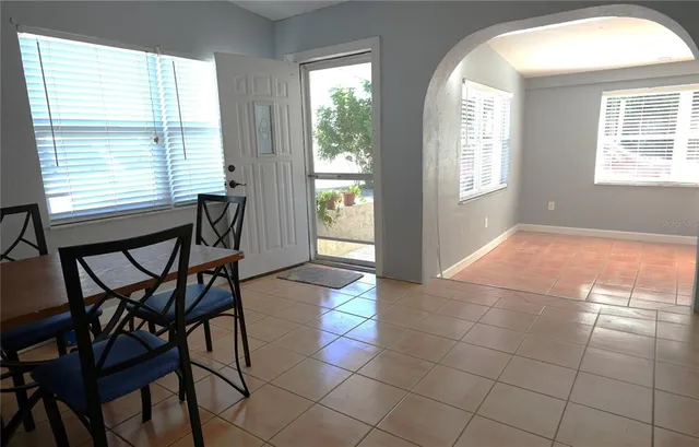 a view of a livingroom with furniture and a window