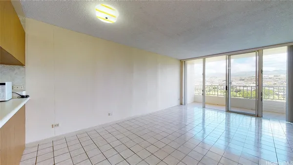 a view of an empty room and window