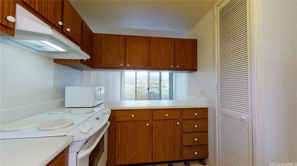 a kitchen with a stove and a refrigerator