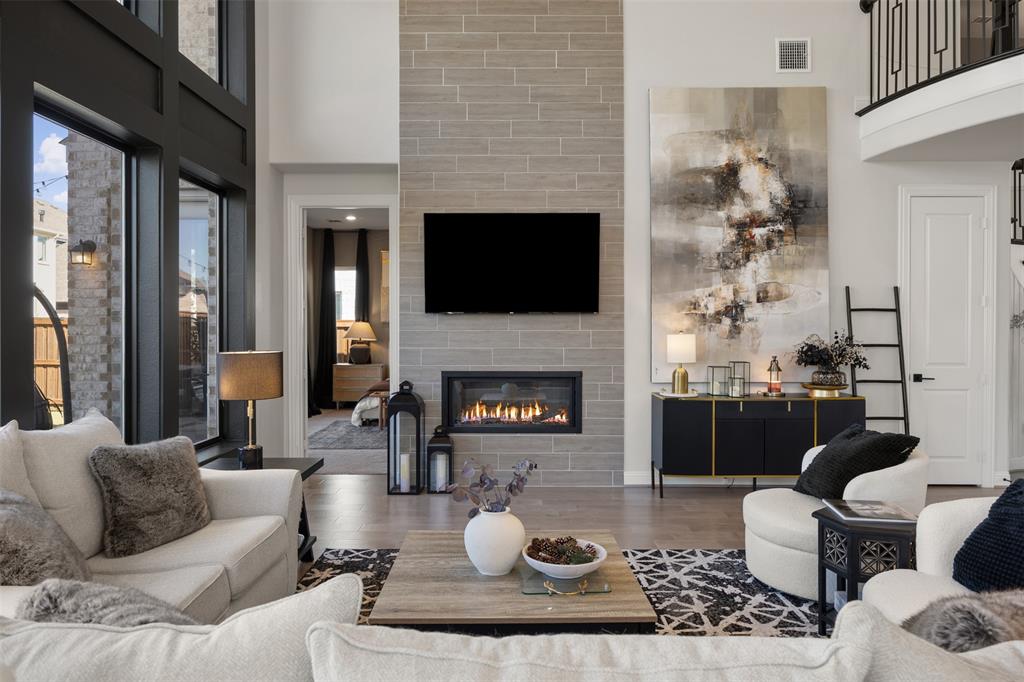 2413 Shane Drive Midlothian, TX 76065 - Photo 12 of 37 a living room with furniture a fireplace and a flat screen tv