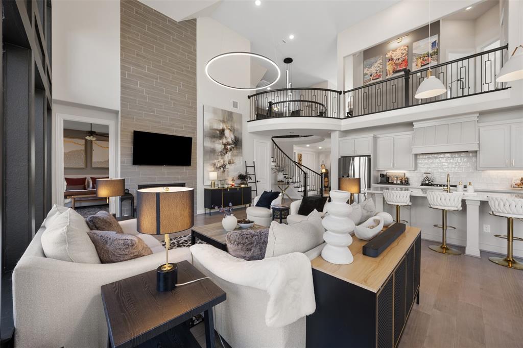 2413 Shane Drive Midlothian, TX 76065 - Photo 13 of 37 a living room with furniture a flat screen tv and kitchen view