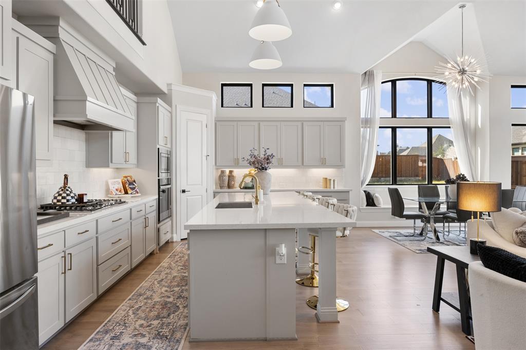 2413 Shane Drive Midlothian, TX 76065 - Photo 18 of 37 a kitchen with stainless steel appliances granite countertop a stove and cabinets