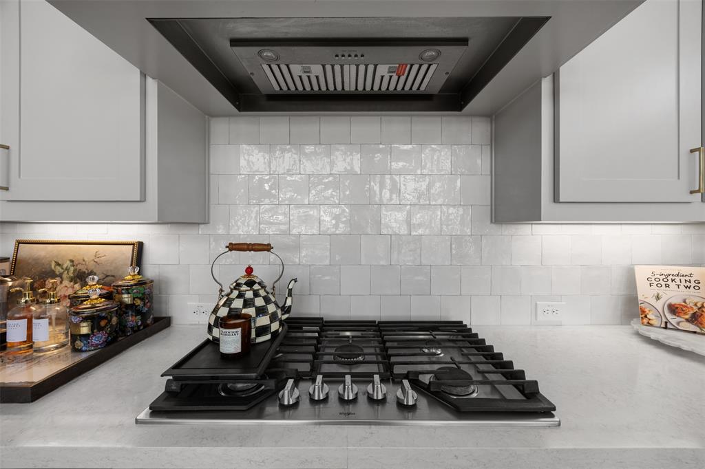 2413 Shane Drive Midlothian, TX 76065 - Photo 19 of 37 a kitchen with wooden cabinets and a stove top oven