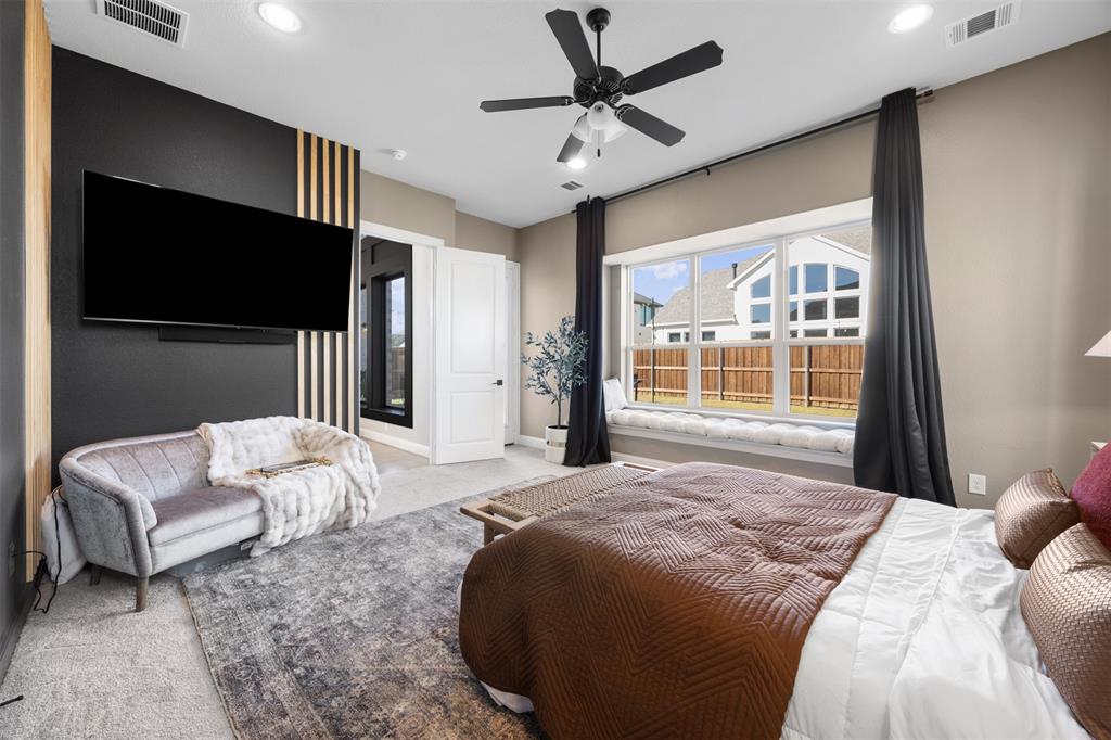 2413 Shane Drive Midlothian, TX 76065 - Photo 23 of 37 a bedroom with a bed couch and a large window