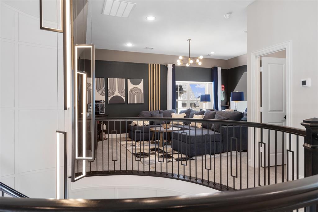 2413 Shane Drive Midlothian, TX 76065 - Photo 25 of 37 a view of a hallway with furniture and chandelier