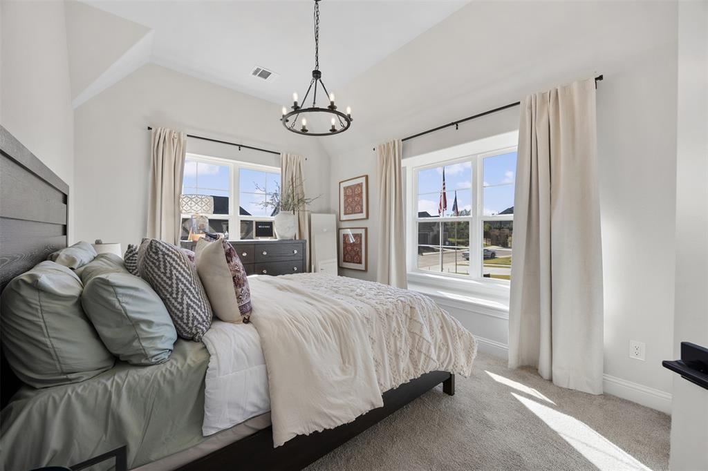 2413 Shane Drive Midlothian, TX 76065 - Photo 32 of 37 a spacious bedroom with a bed and a window