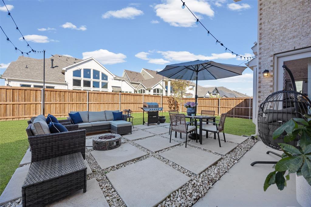 2413 Shane Drive Midlothian, TX 76065 - Photo 35 of 37 a view of a patio with a dining table and chairs