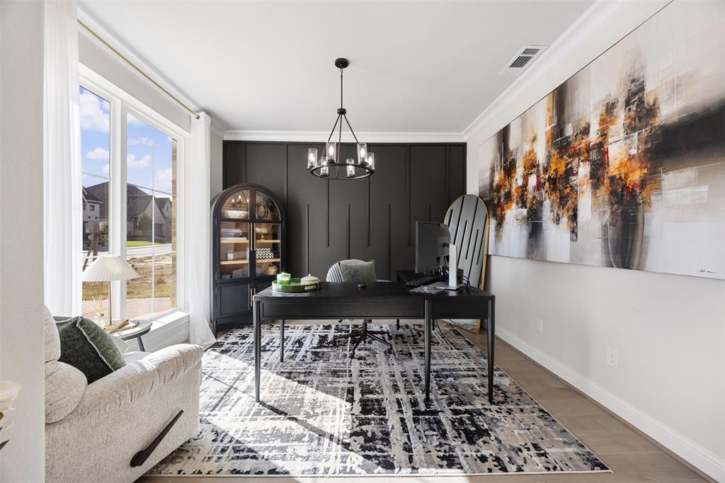 2413 Shane Drive Midlothian, TX 76065 - Photo 8 of 37 a living room with furniture and a chandelier
