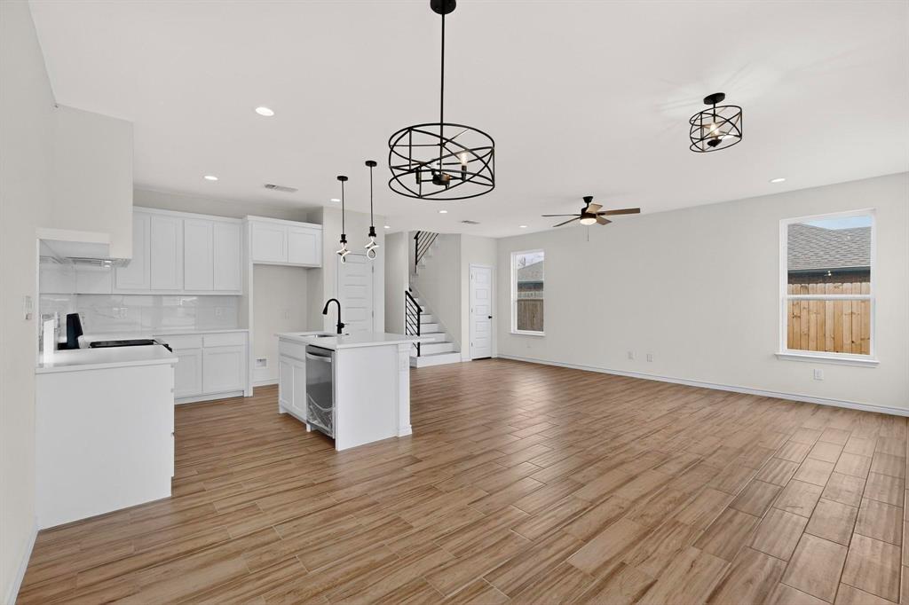 1610 Life Avenue Dallas, TX 75212 - Photo 11 of 38 a view of a kitchen with stove and wooden floor
